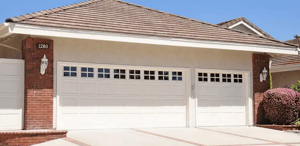 Residential garage door repair service for a double garage door in Kansas City, MO
