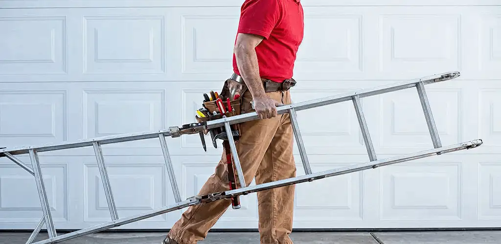 Garage door repair technician arriving with tools and ladder in Kansas City, MO