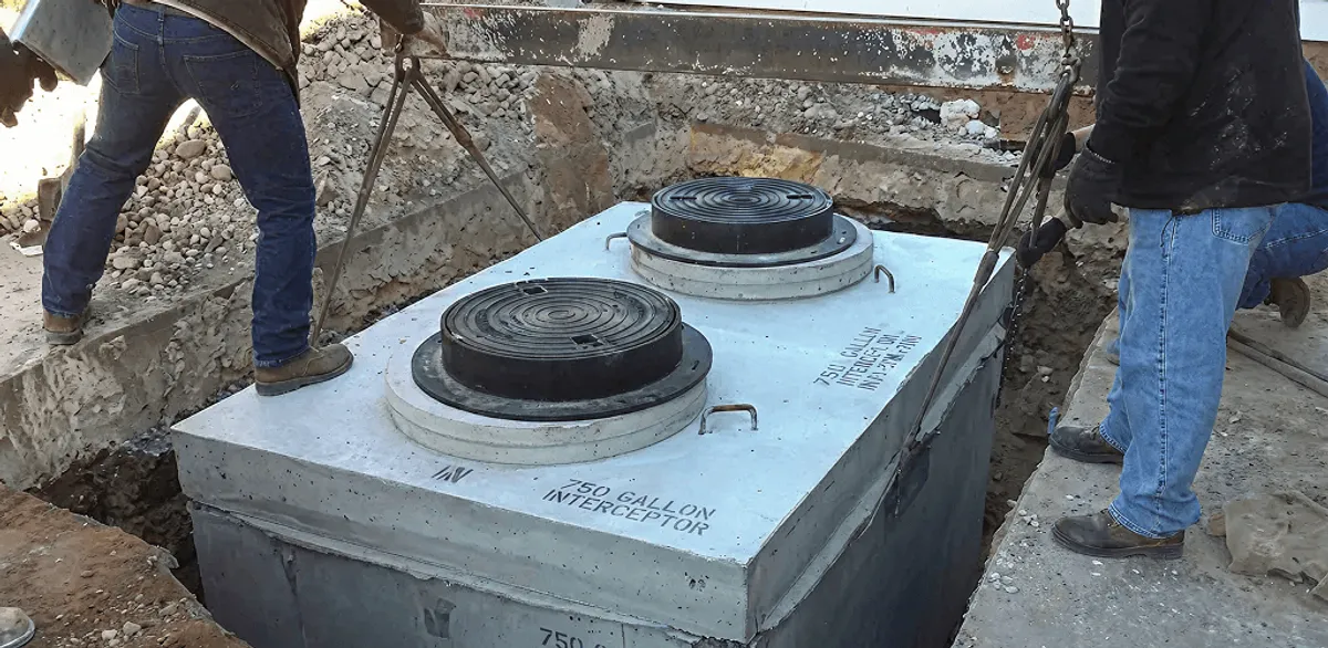 Grease trap installation for a commercial property drainage system in Kansas City, MO
