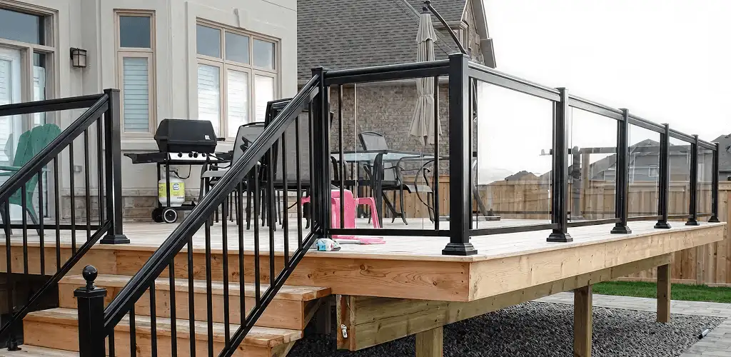 Handrail installation on a deck staircase for safety and code compliance in Kansas City, MO